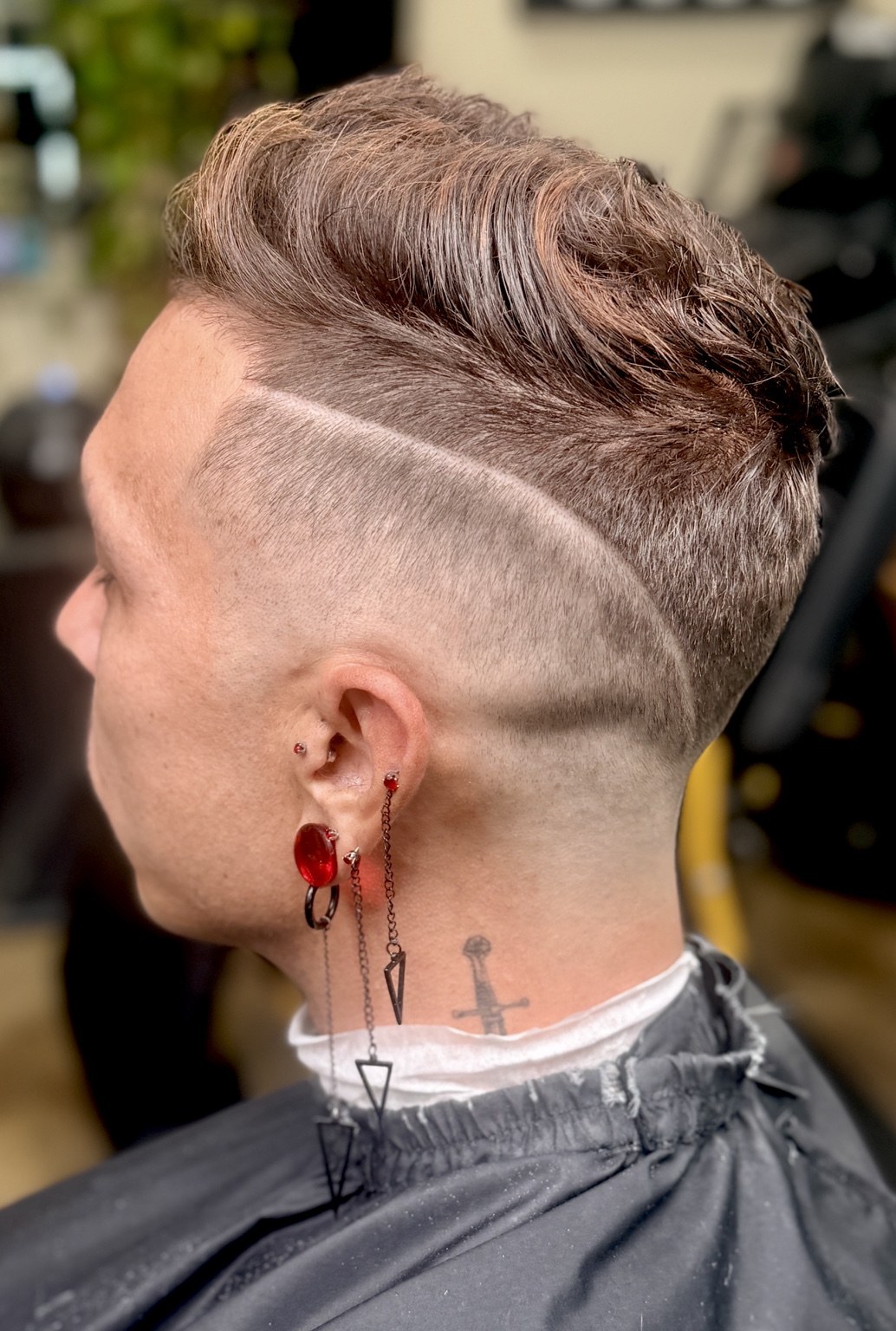 Textured short haircut with a shaved design