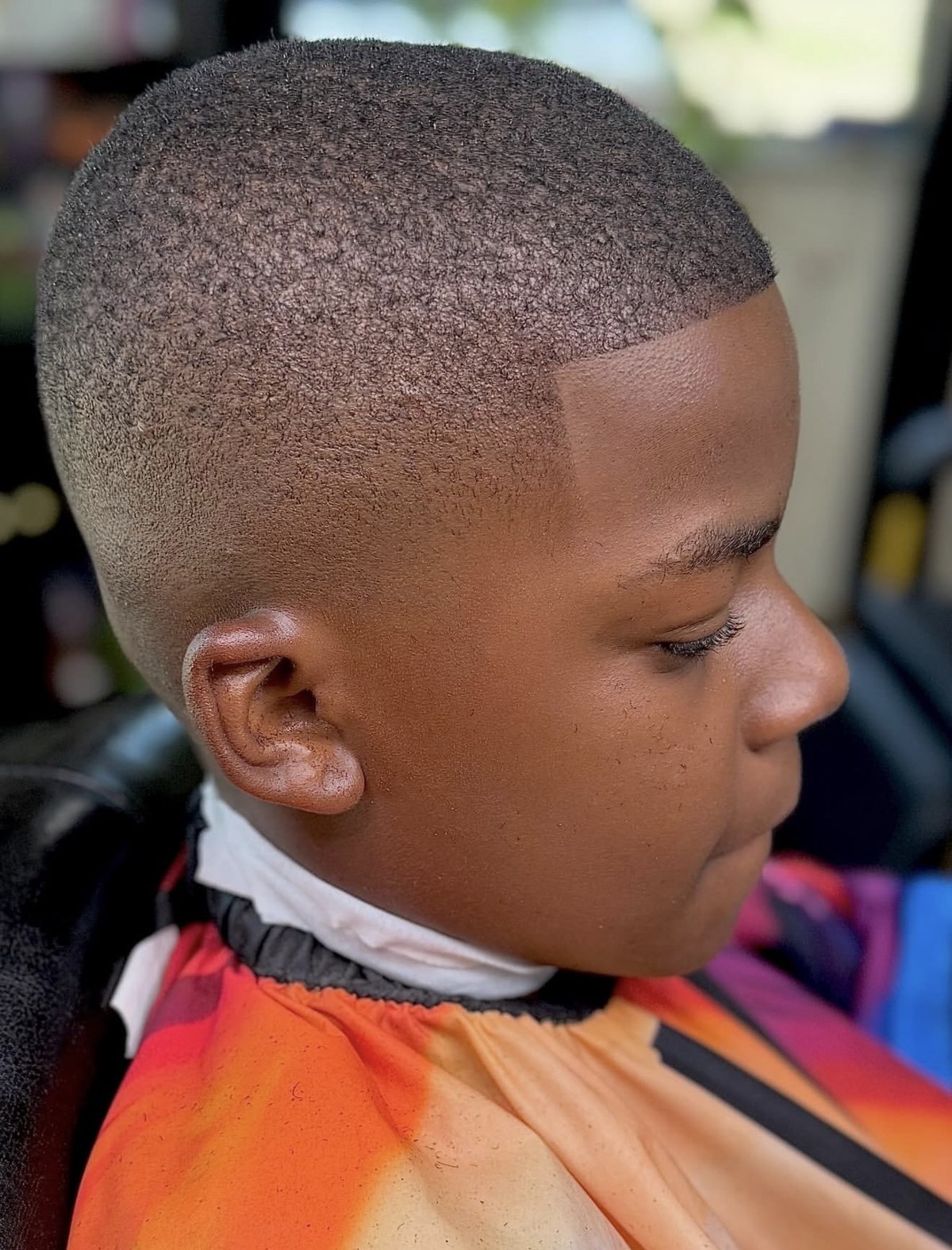 Kids haircut with a clean fade and sharp hairline